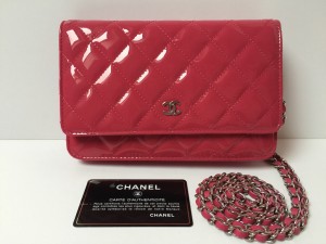 Chanel WOC in Pink diamond quilted Patent Leather with silver hardware.