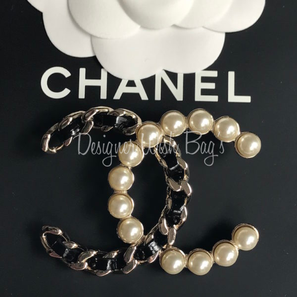 chanel brooch on dress