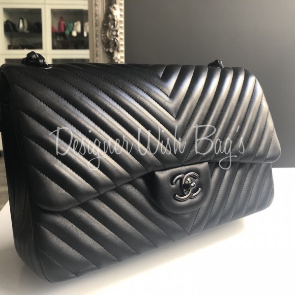 CHANEL - Jumbo Classic Flap CC Quilted Black Lambskin Shoulder Bag