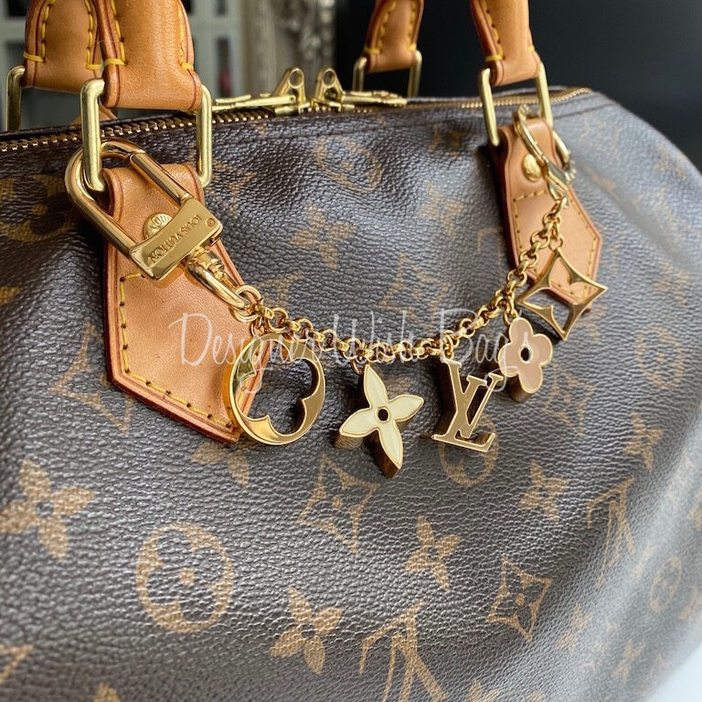 Leather bag charm Louis Vuitton Camel in Leather - 31142388