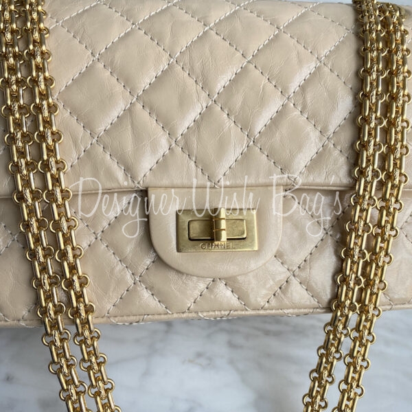 Chanel Beige Iridescent Caviar 2.55 Reissue 226 Double Flap Bag – Dina C's  Fab and Funky Consignment Boutique