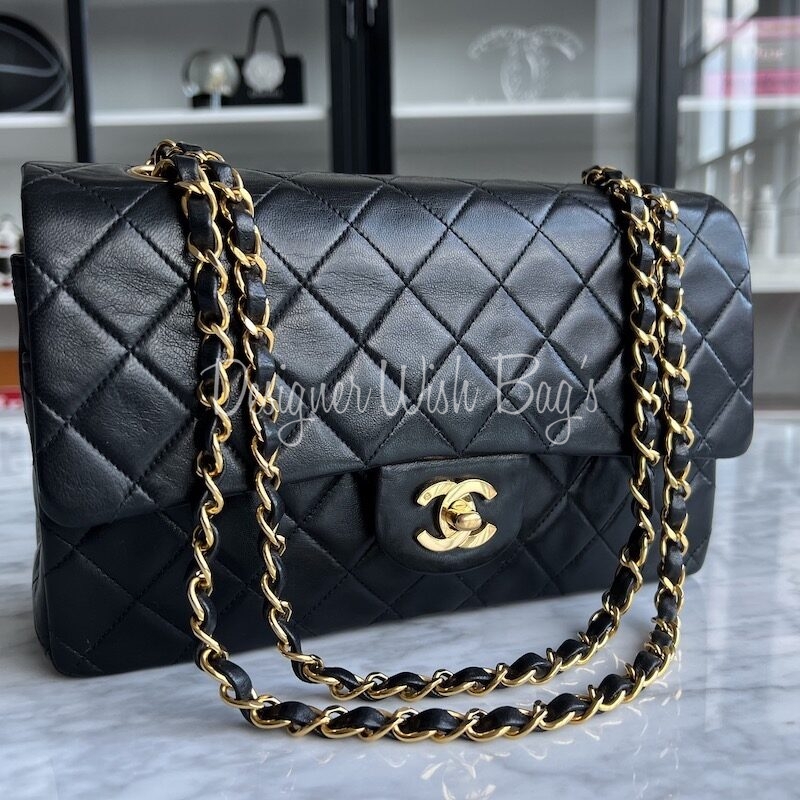 Vintage CHANEL black lambskin large classic bag with double golden