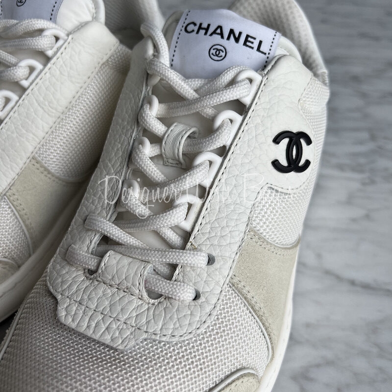 silver and white chanel sneakers