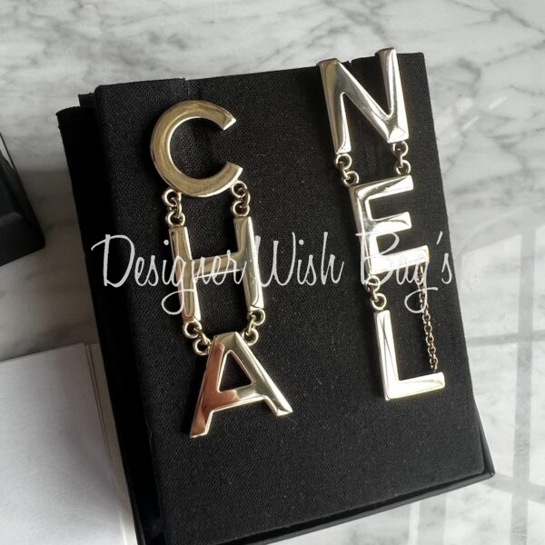 Chanel Runway Silver-Tone Monogram Earrings, 2006 | Auctions at Showplace